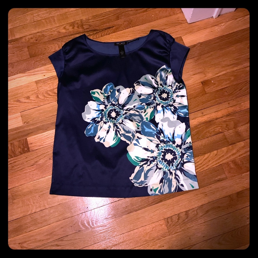 Navy satin top with flower.